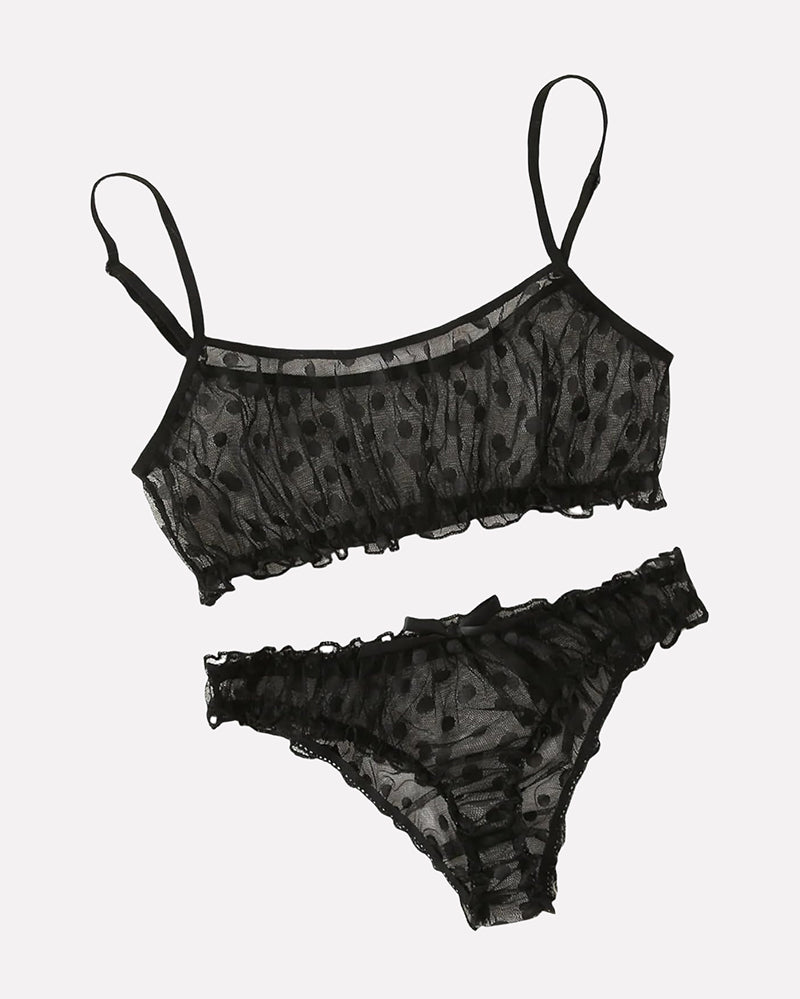 Black polka dot mesh lingerie set with ruffles. Sheer bra and panty designed for confidence.