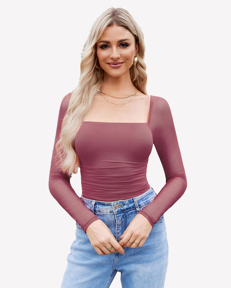 Mauve mesh square neck bodysuit with ruched detail, long sleeve. Model in jeans and gold jewelry.