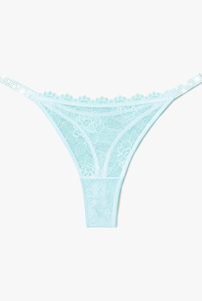 Light blue lace thong lingerie with rhinestone straps for women. Sexy and transparent design.