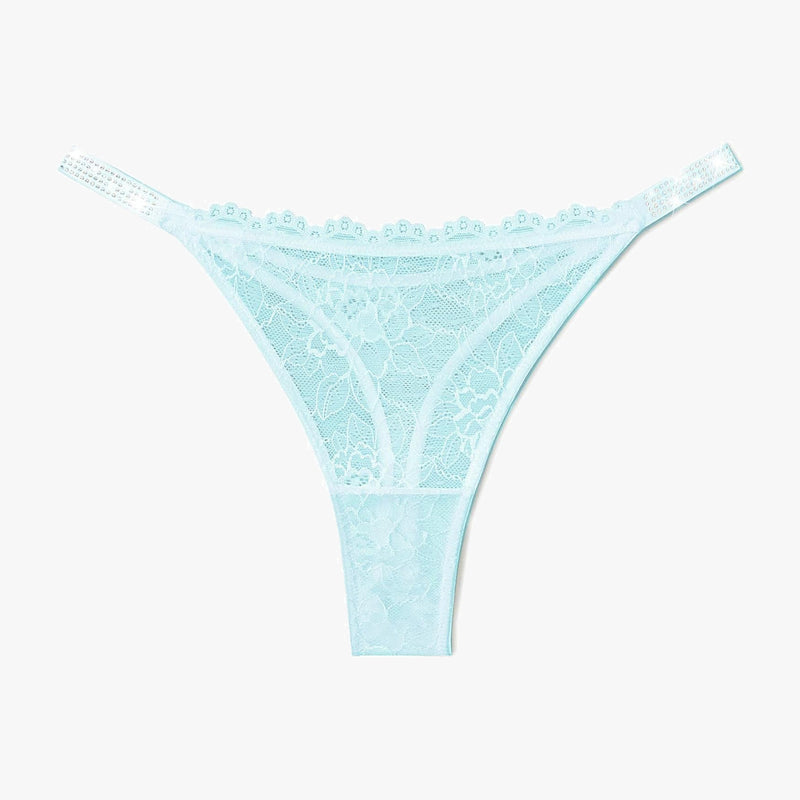 Light blue lace thong lingerie with rhinestone straps for women. Sexy and transparent design.