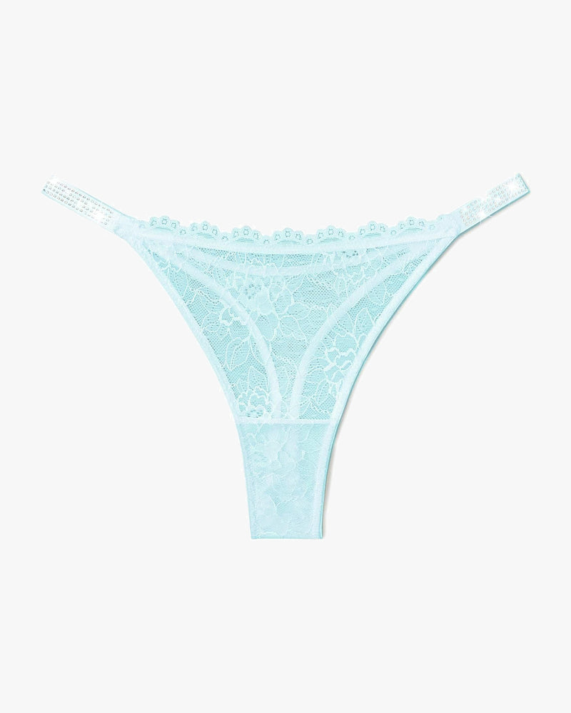 Light blue lace thong lingerie with rhinestone straps for women. Sexy and transparent design.