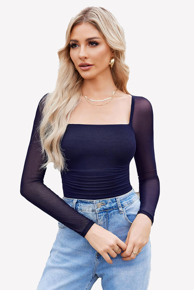 Navy mesh square neck bodysuit, long sleeve, ruched detail, model in jeans and gold jewelry