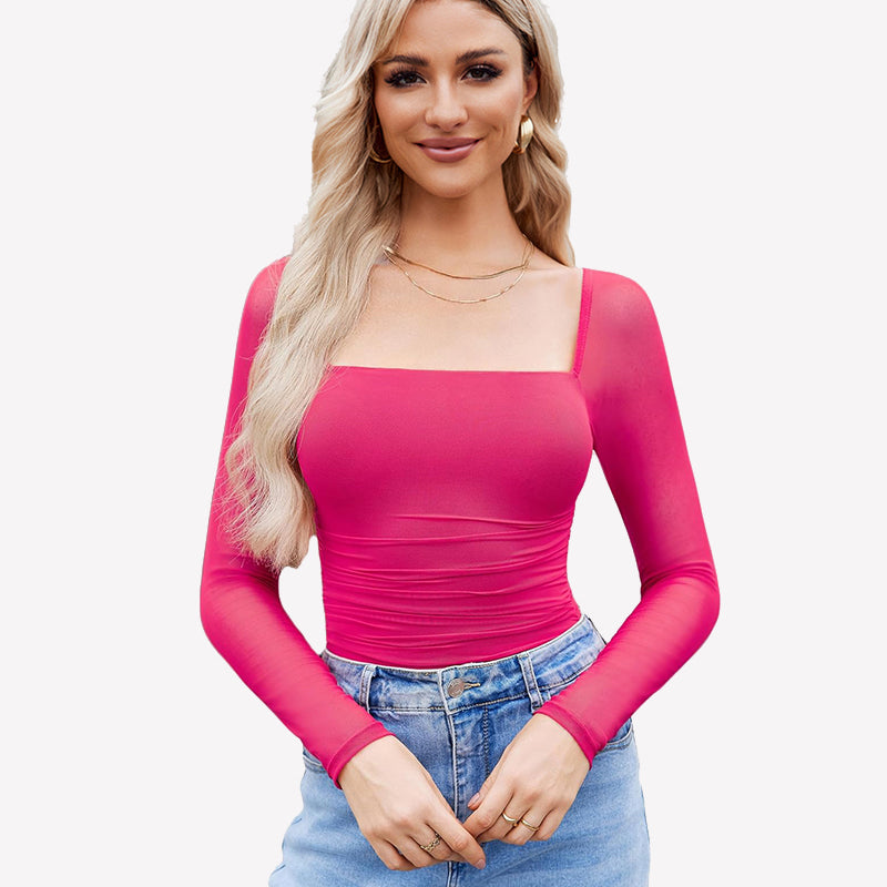 Pink square neck mesh bodysuit with ruched detail and long sleeves. Model in jeans and gold jewelry.