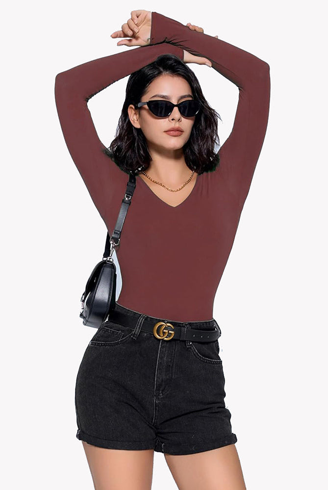 Burgundy V-neck long sleeve bodysuit. Confident and classy. Paired with black shorts and belt.