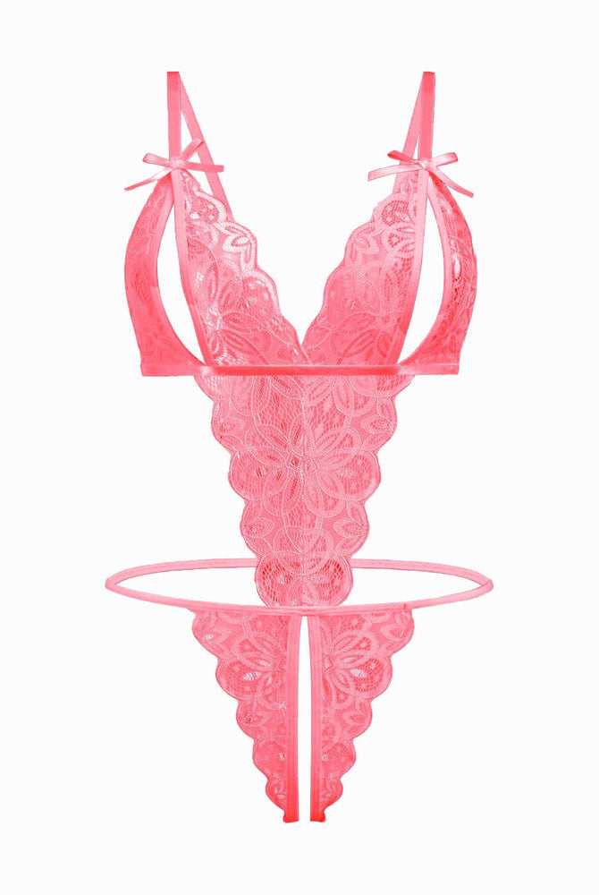Pink lace bodysuit with open cup, bow details, and backless design. Sexy lingerie for a hot night.
