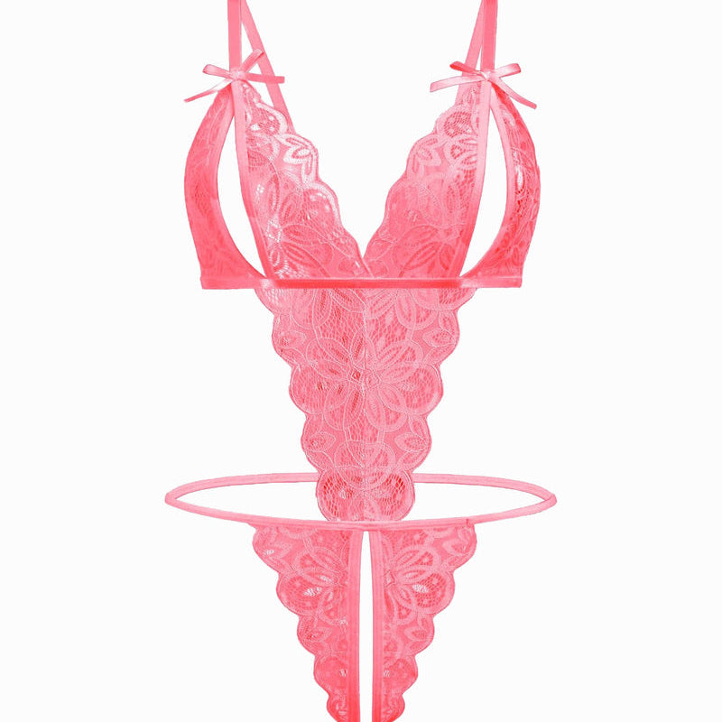 Pink lace bodysuit with open cup, bow details, and backless design. Sexy lingerie for a hot night.