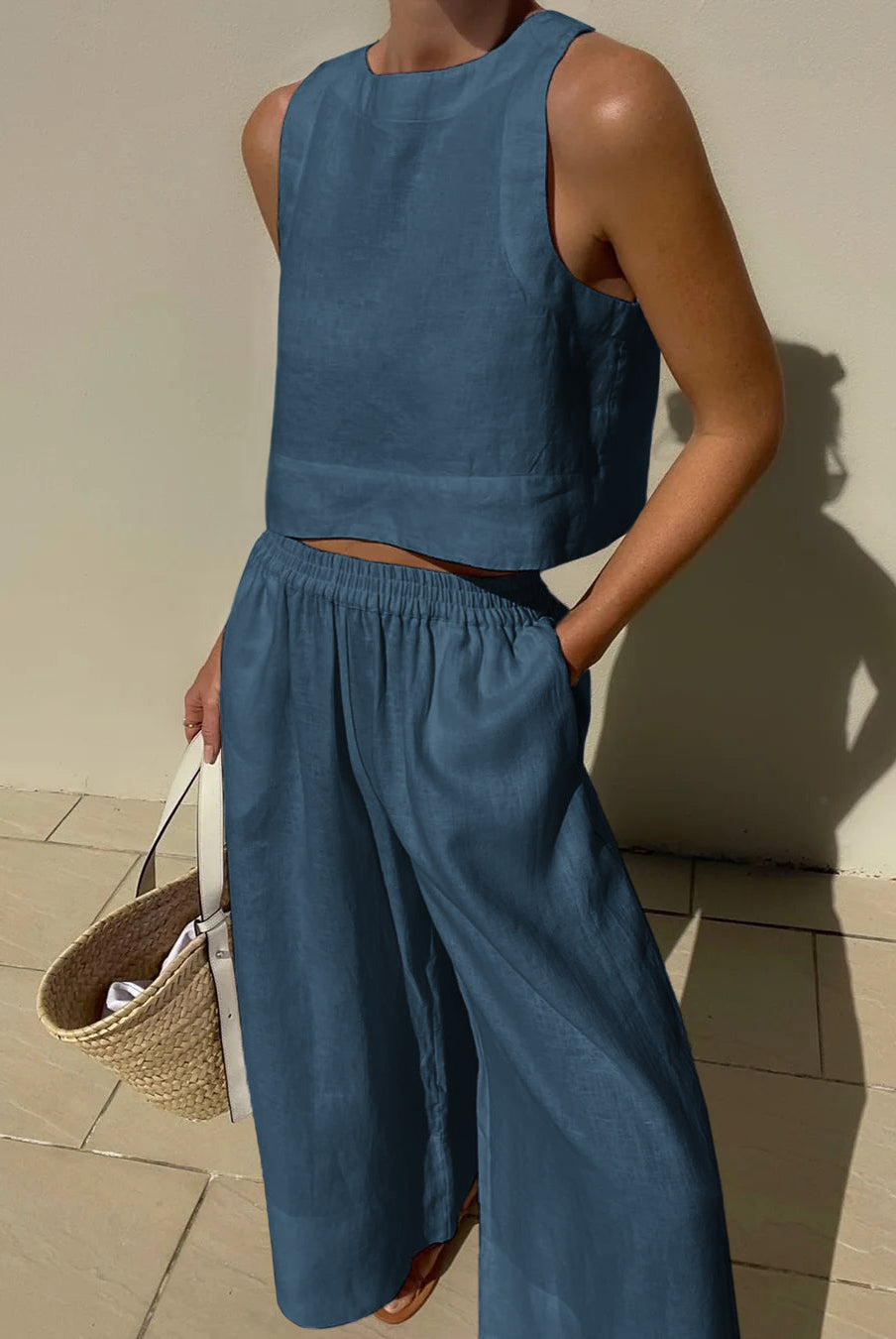 Blue linen crop top and wide leg pants set. Vacation style, breathable summer outfit.