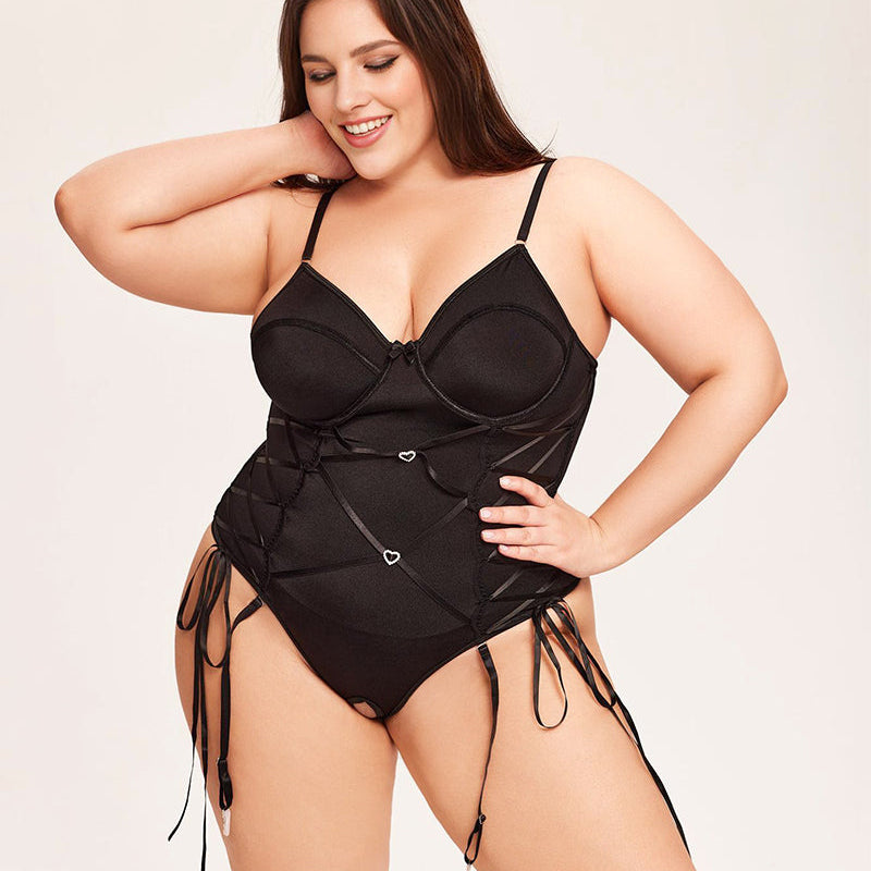 Black tummy control bodysuit with garter belt for women, adjustable straps, and underwire cups