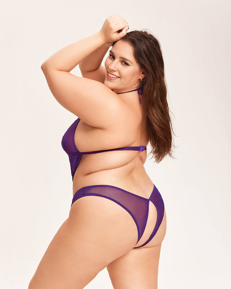 Purple deep V halter teddy bodysuit on a plus-size woman, floral lace details, nightwear lingerie.