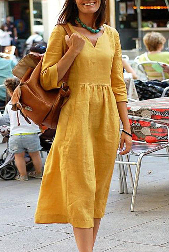 Yellow linen beach dress with V-neck and 3/4 sleeves, a perfect vacation style