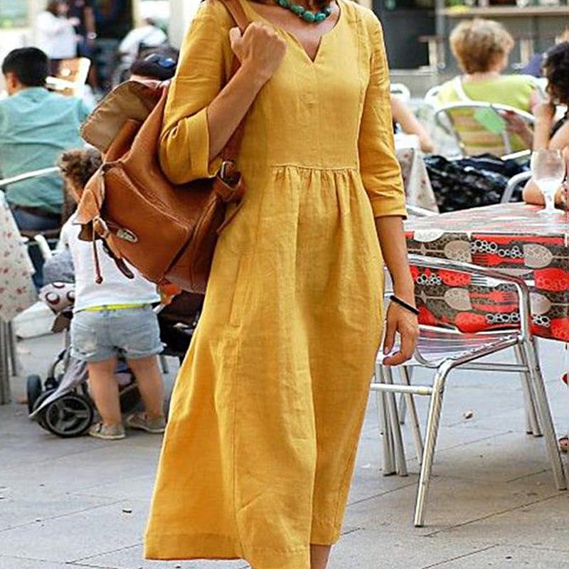 Yellow linen beach dress with V-neck and 3/4 sleeves, a perfect vacation style