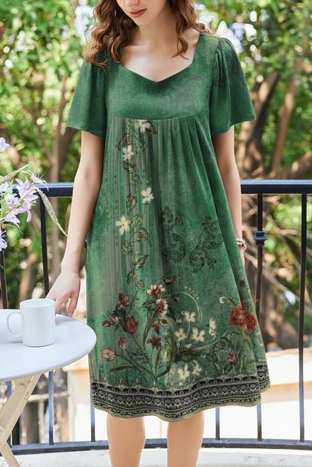 Women’s pleated house dress, green with ornate floral print border, short sleeves