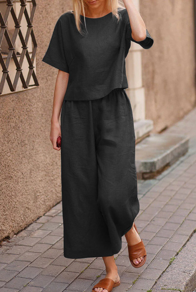 Black two-piece set with loose T-shirt and wide-leg pants