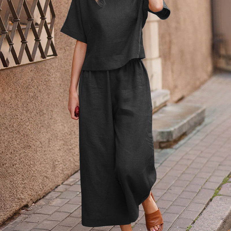 Black two-piece set with loose T-shirt and wide-leg pants