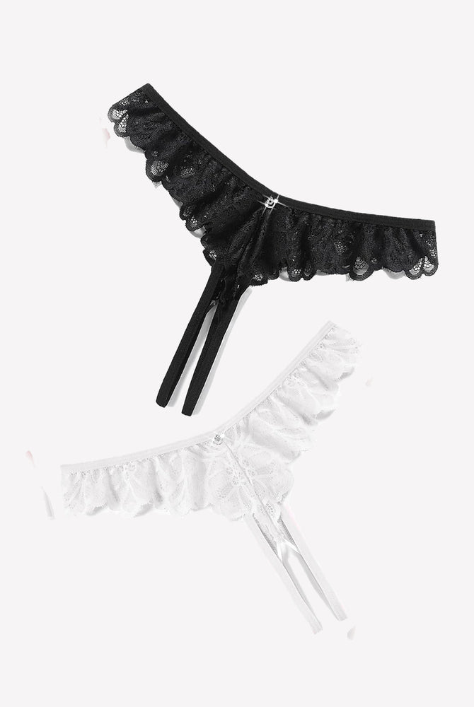 Black and white lace thong briefs with criss-cross design, ruffle trim, and rhinestone details
