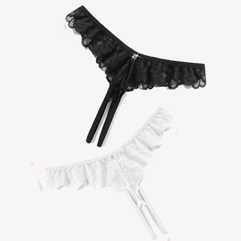 Black and white lace thong briefs with criss-cross design, ruffle trim, and rhinestone details