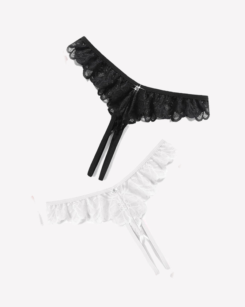 Black and white lace thong briefs with criss-cross design, ruffle trim, and rhinestone details