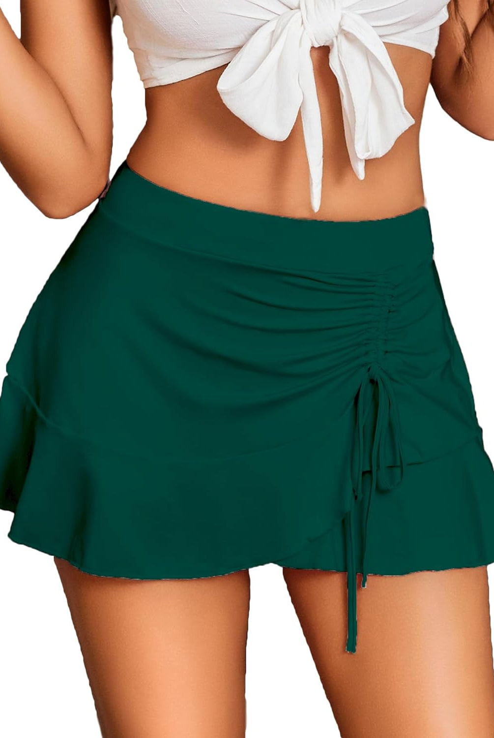 Green pleated mini skirt with wrap front and ruffle detail, a stylish and sexy look for women