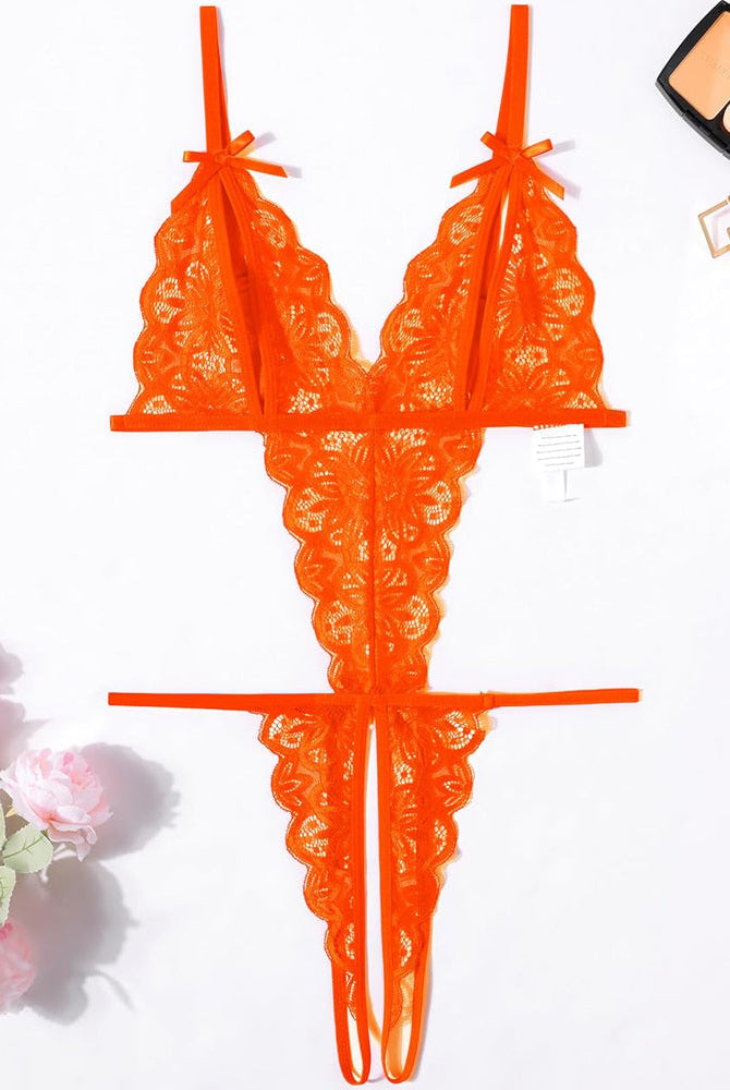 Orange lace bodysuit with open cup, backless design, and bow details. Sexy lingerie for a hot night.