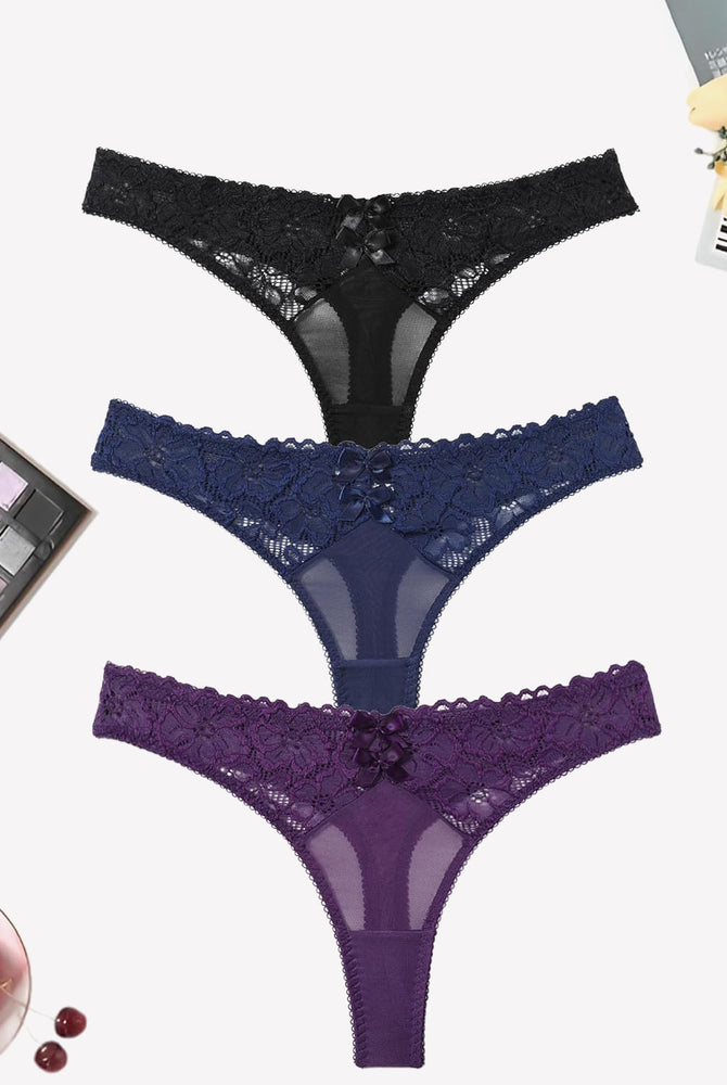 Low waist mesh lace thongs in black, navy, and purple with bow detail, elegant lingerie.