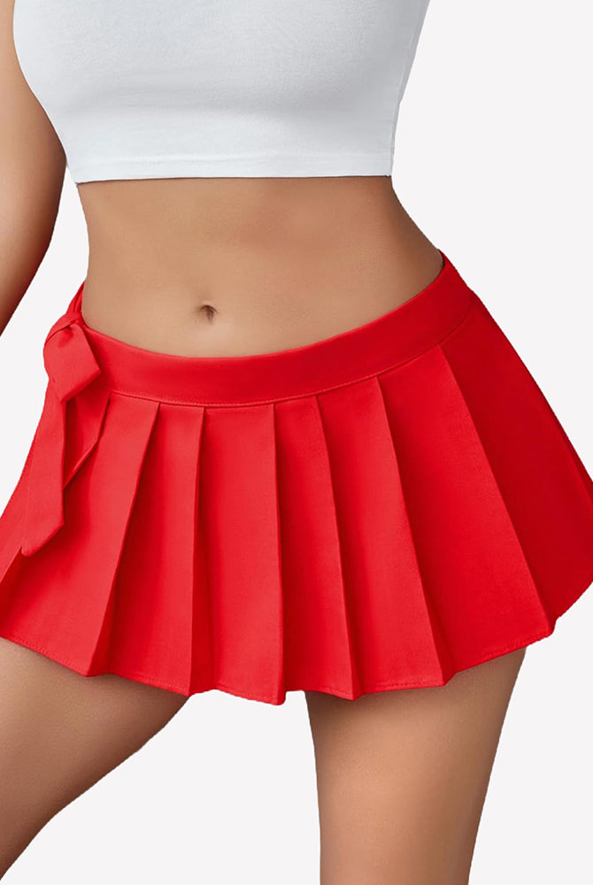Red pleated mini skirt with side bow, role play outfit. Polyester Spandex, flirty and confident.