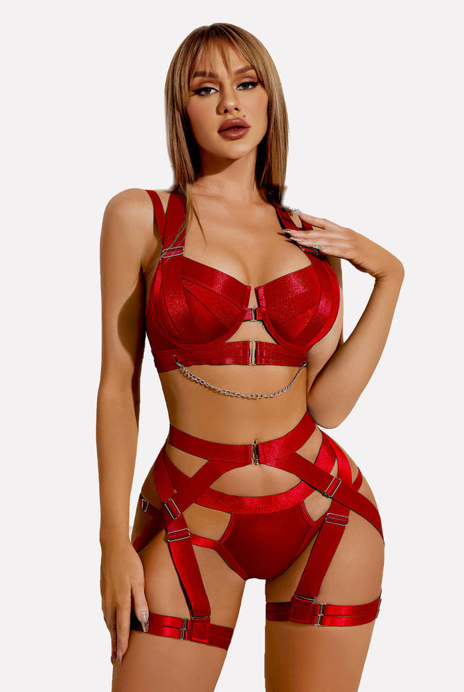 Red lingerie garter set with chain detail, halter bra, and high-waisted straps for women