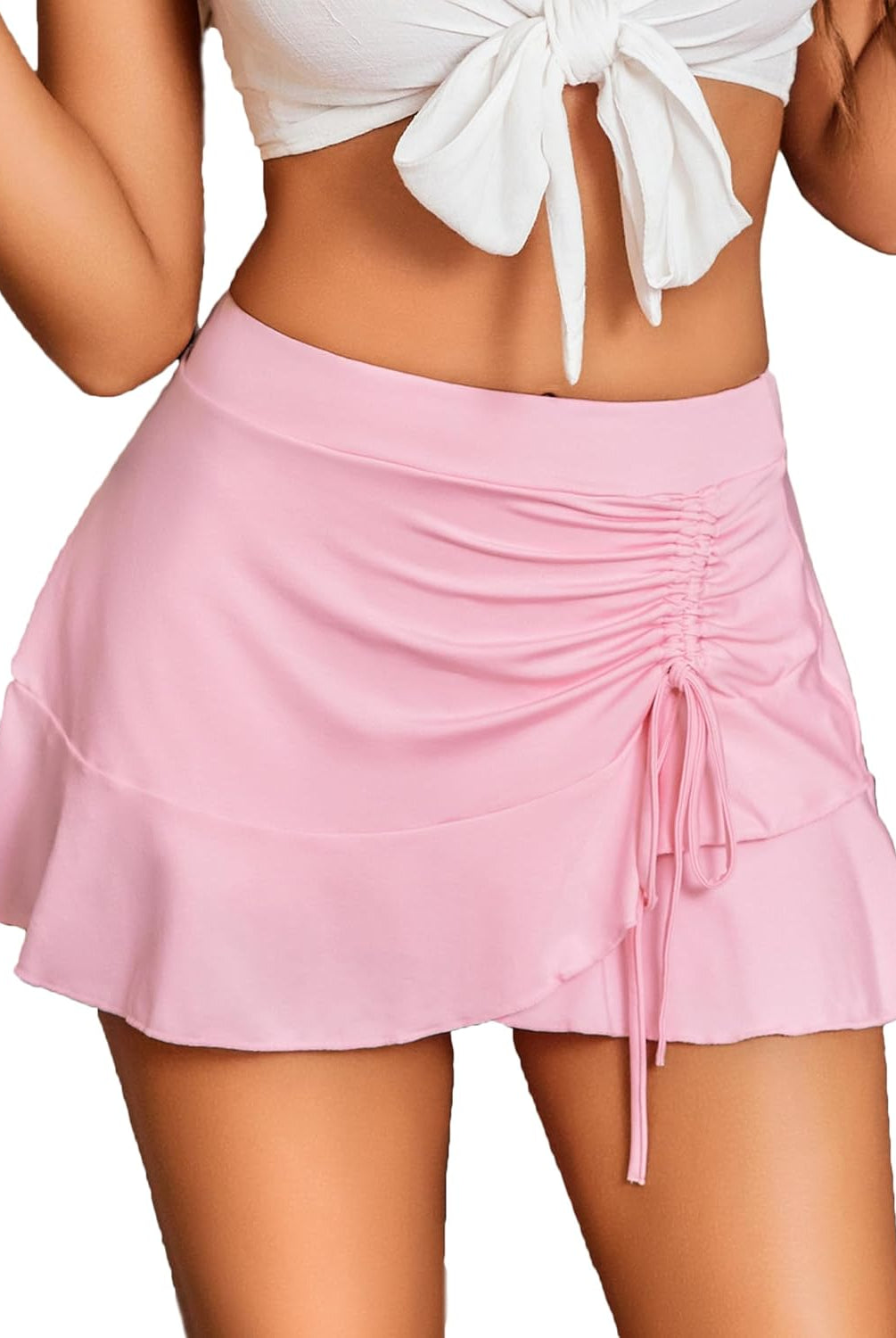 Light pink pleated drawstring wrap mini skirt with ruffle detail, a stylish and sexy look for women.