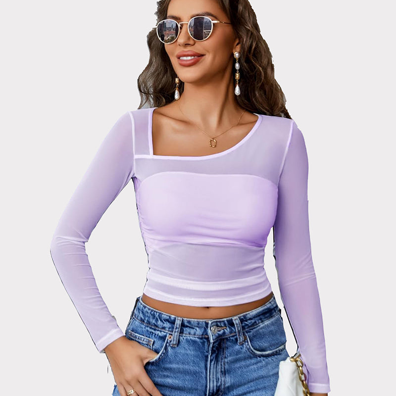Avidlove lavender mesh asymmetrical crop top with long sleeves and denim jeans. Sheer, stylish top.