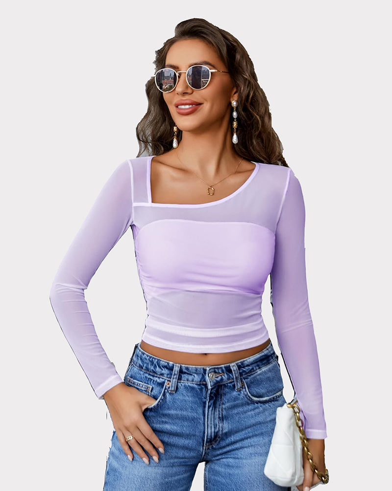 Avidlove lavender mesh asymmetrical crop top with long sleeves and denim jeans. Sheer, stylish top.