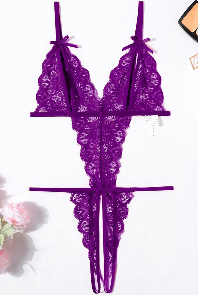 Purple lace bodysuit with deep V-neck, open cup, backless design, and bow details. Sexy lingerie.