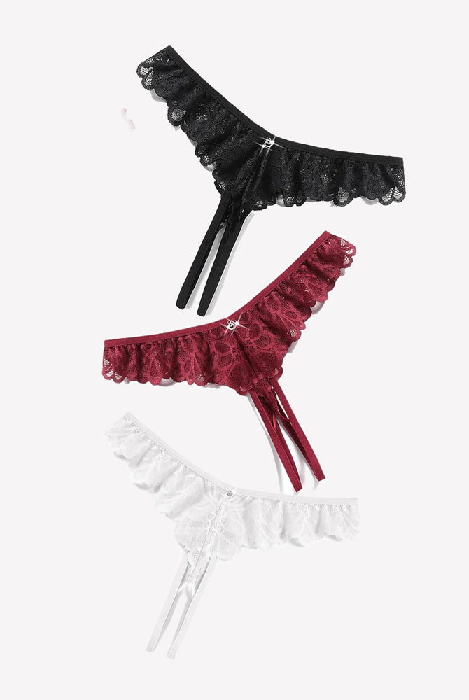 Lace thong briefs in black, burgundy, and white with criss-cross design and rhinestone details