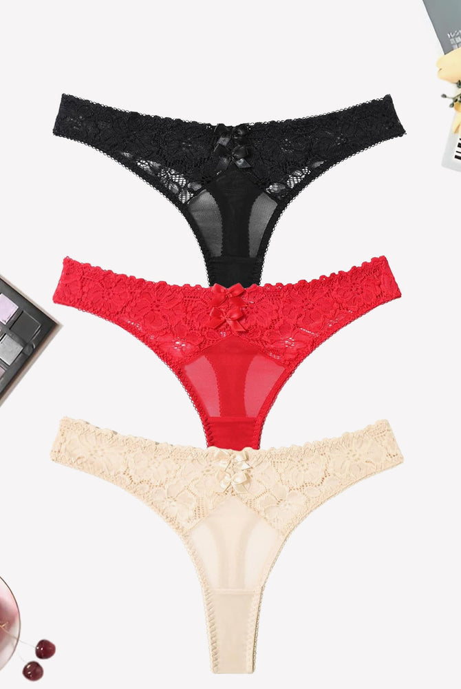 Mesh lace thongs in black, red, and beige with bow detail. Low waist panties for an elegant look.