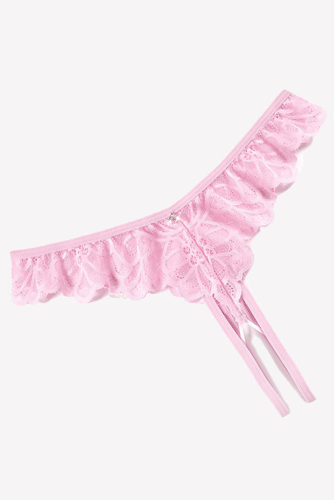 Pink lace thong panties with criss-cross design, ruffle trim, and rhinestone details.