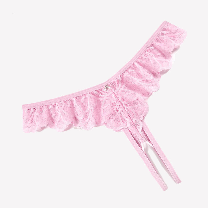 Pink lace thong panties with criss-cross design, ruffle trim, and rhinestone details.