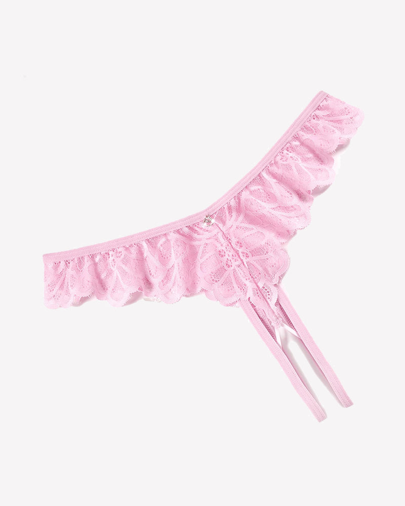 Pink lace thong panties with criss-cross design, ruffle trim, and rhinestone details.