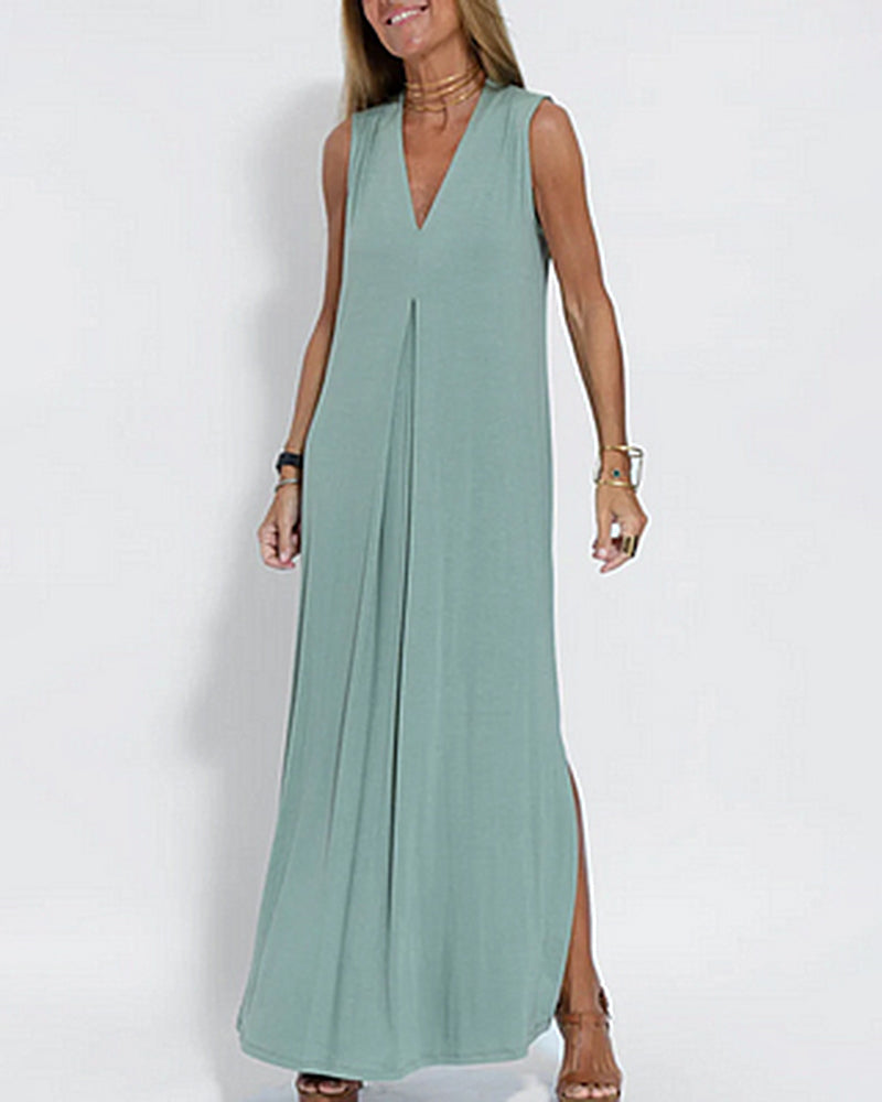 Soft green sleeveless maxi dress with V-neck, floor-length, and side slits for elegant style.