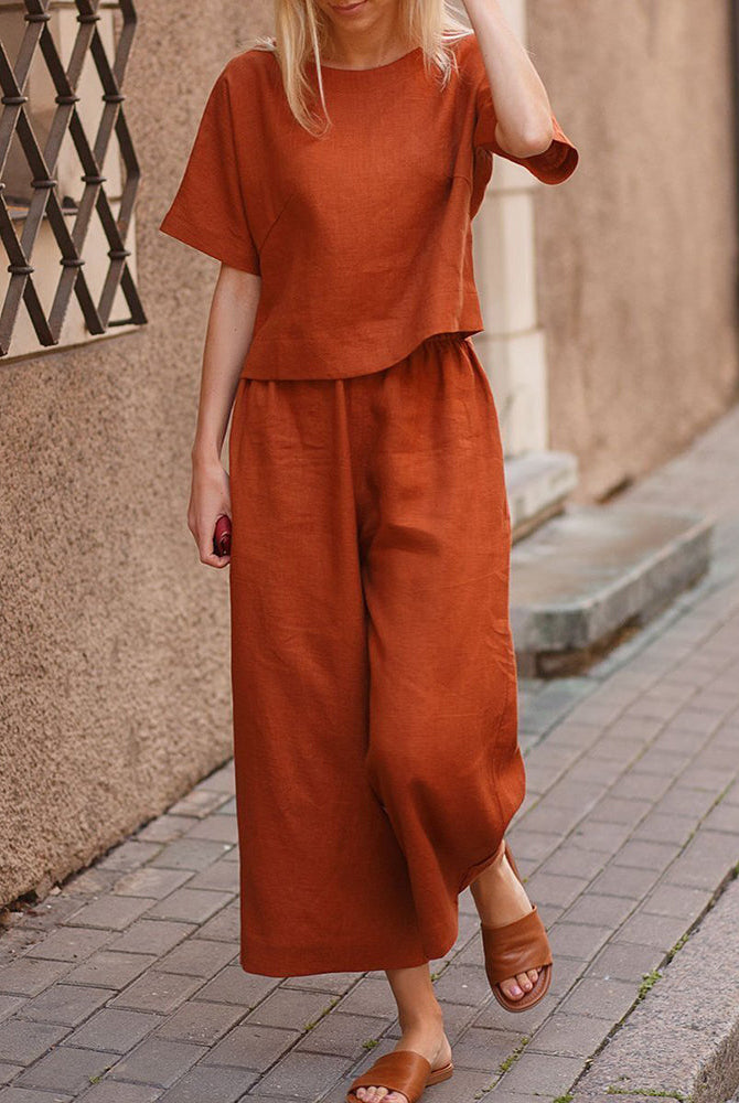 Burnt orange loose fit two piece set made of linen-like material. Comfortable and stylish outfit.