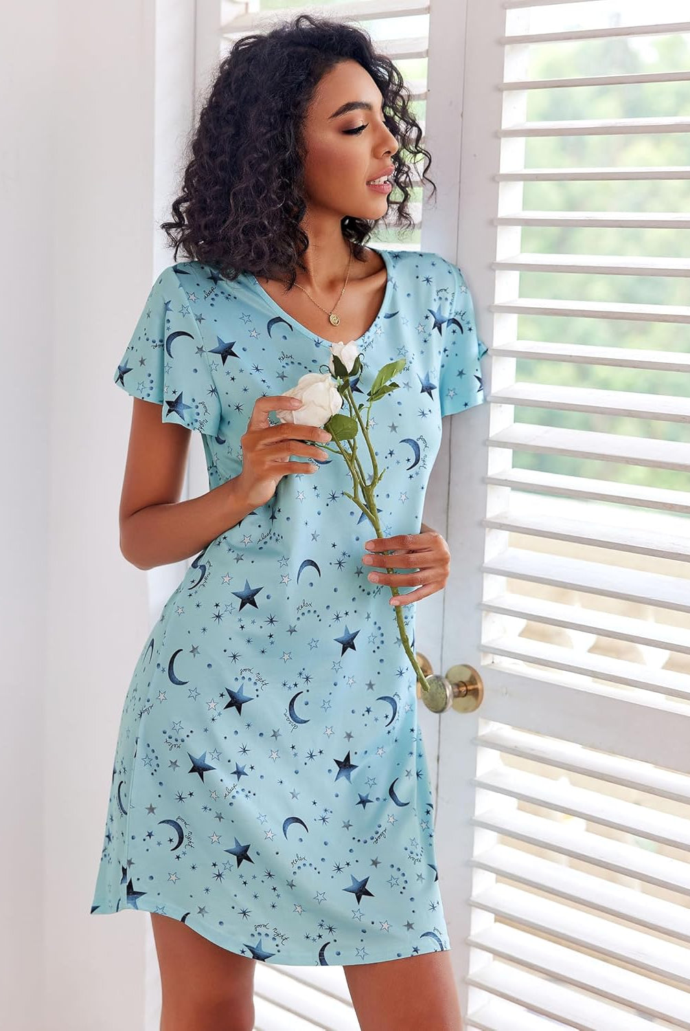 Blue nightshirt dress with moon and star print, short sleeves, V-neck