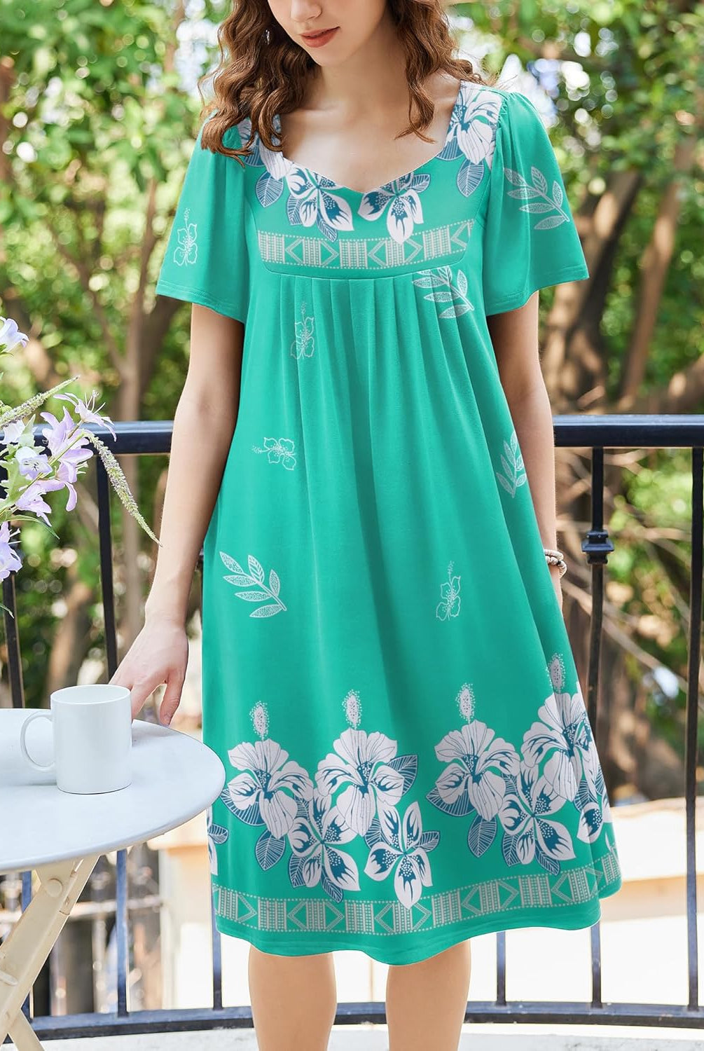 Teal floral pleated house dress with scoop neckline and short sleeves