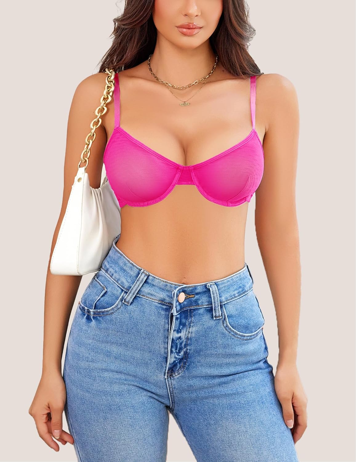 Pink sheer mesh bra; stylish lingerie; highlighting natural contours with jeans