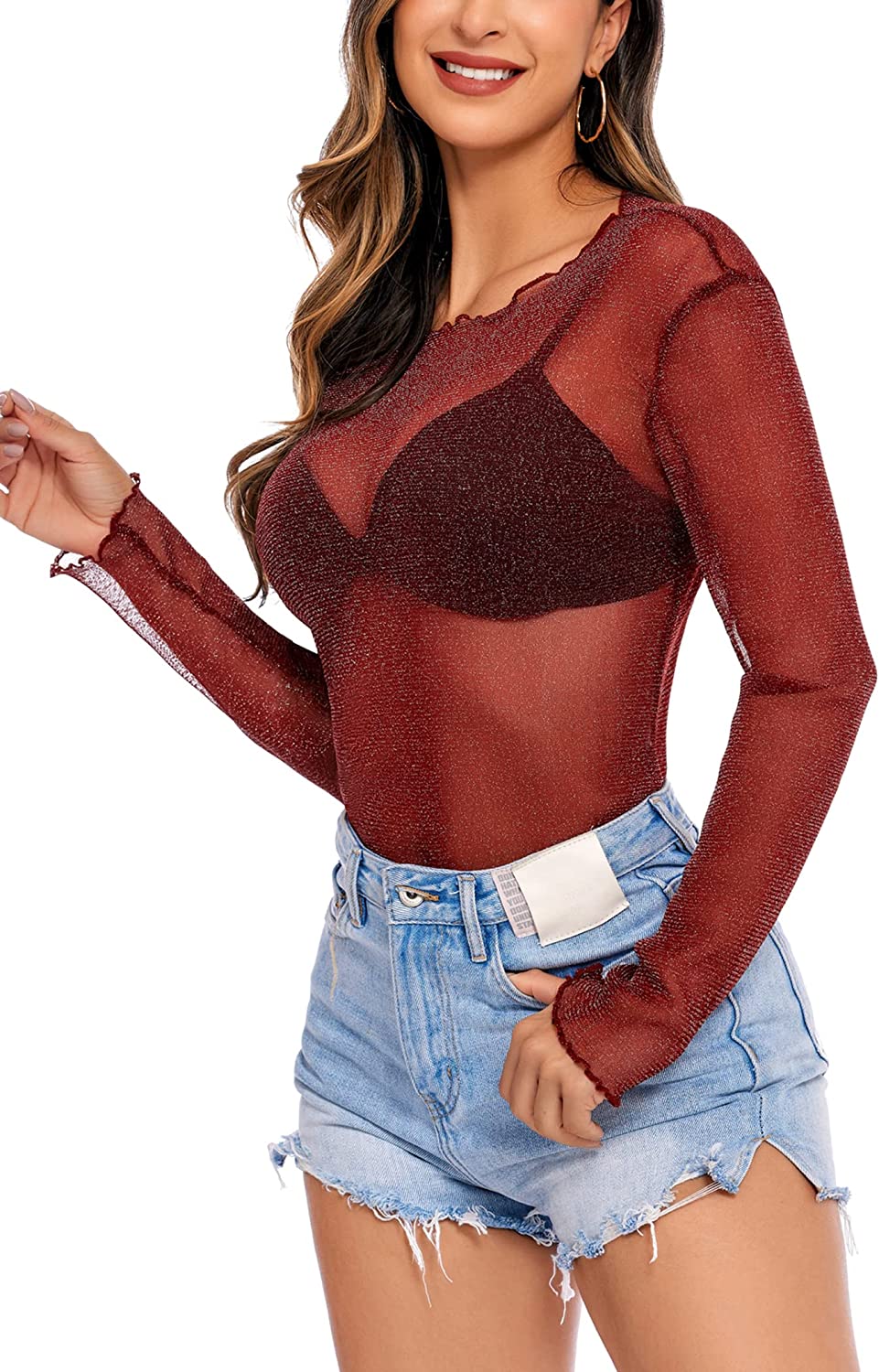 Burgundy mesh top with long sleeves, paired with denim shorts. A stylish and sexy outfit for women.