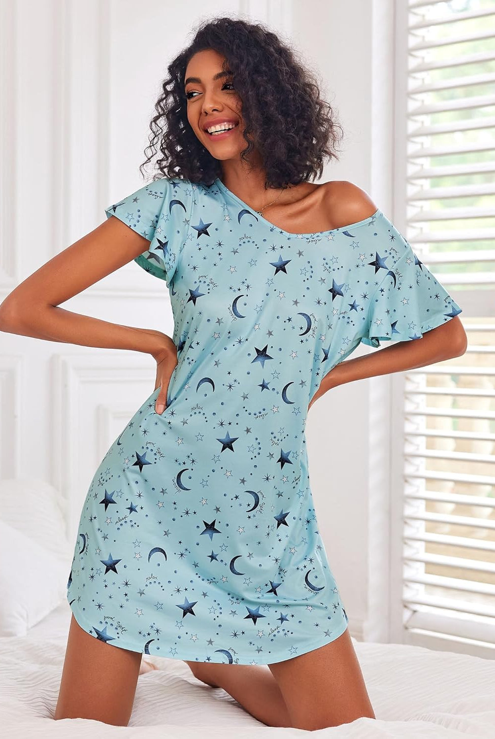 Blue nightshirt dress with moon and star print, one-shoulder short sleeve