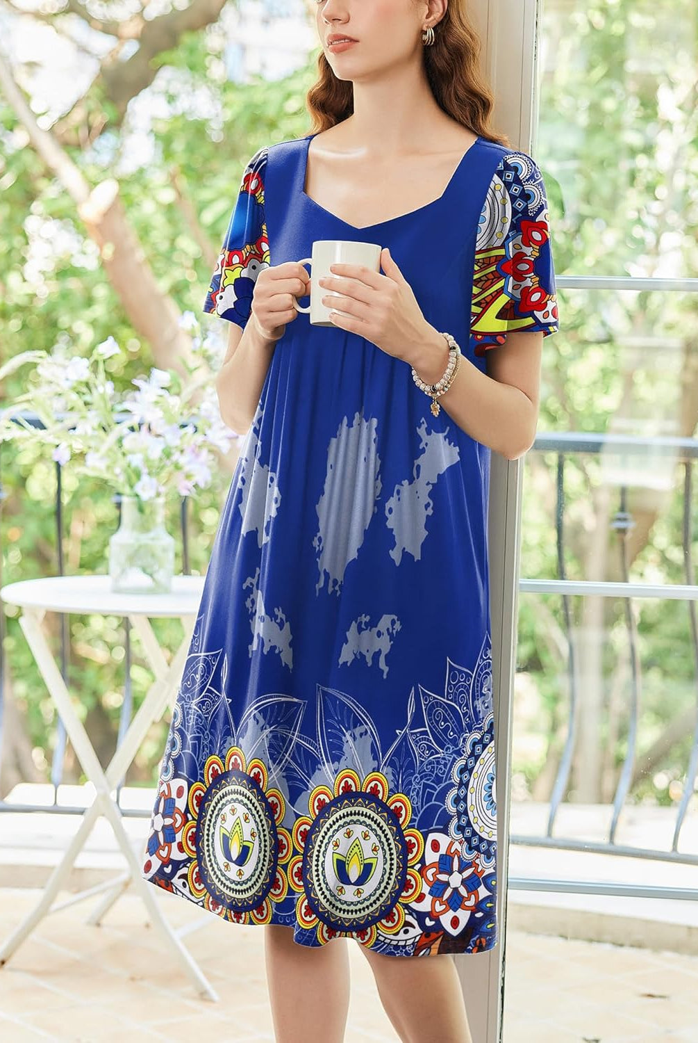 Women’s house dress in royal blue with colorful medallion border hem, short sleeves