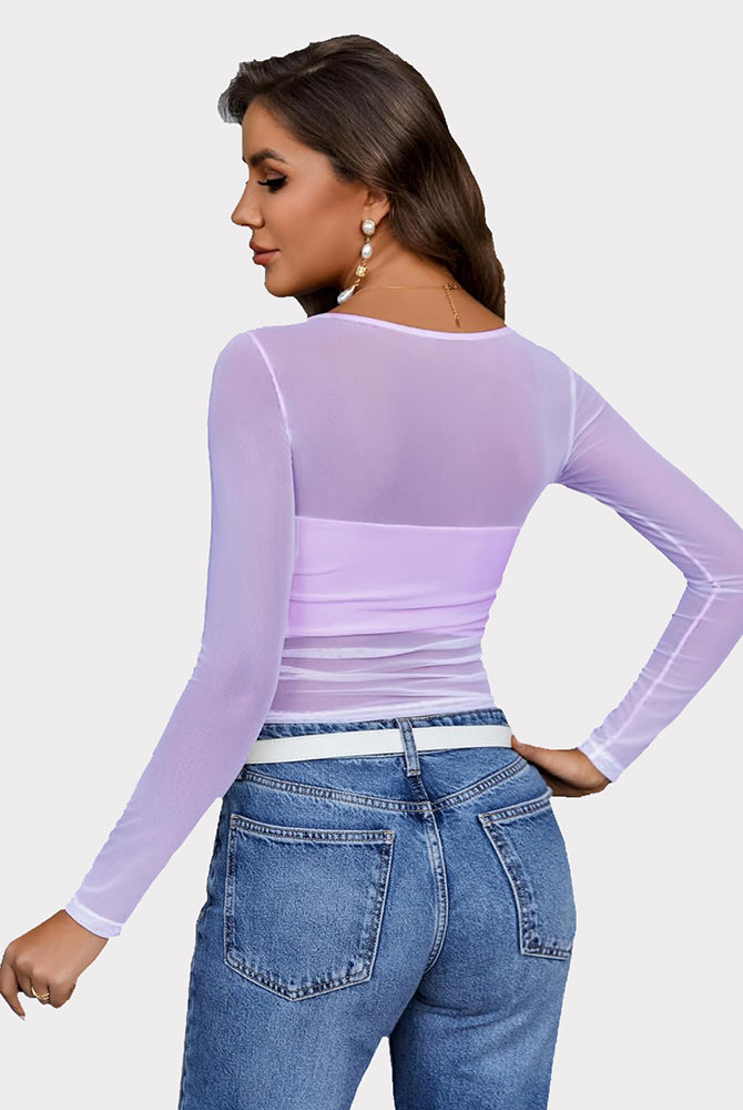 Lavender mesh asymmetrical crop top with long sleeves and jeans. Sheer, stylish top by Avidlove.