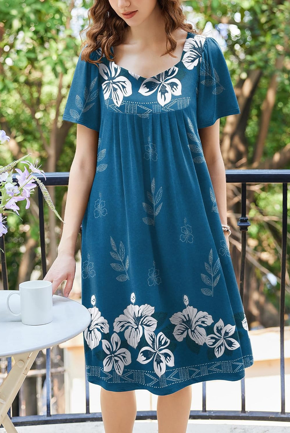 Blue floral pleated house dress with square neckline and short sleeves