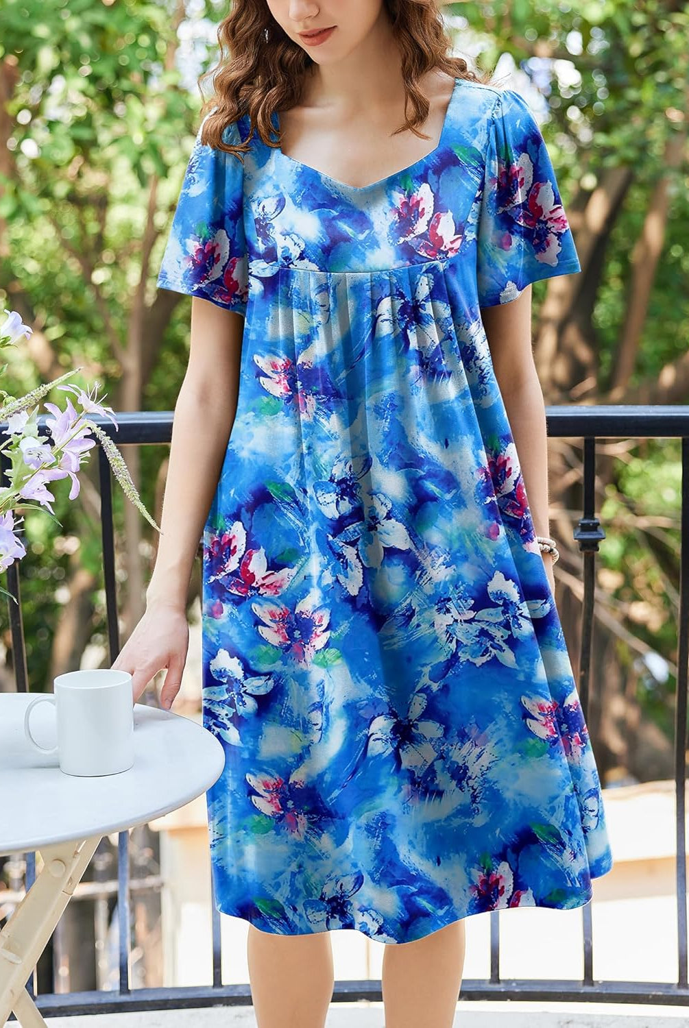 Blue watercolor floral babydoll dress with V-scoop neckline and pleated skirt