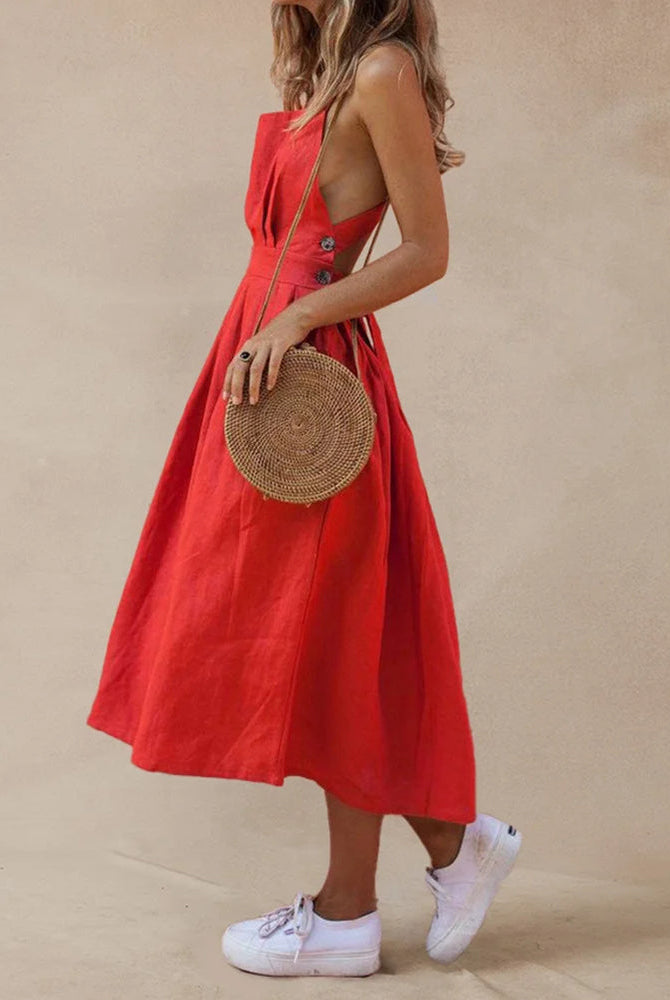 Red strap button waist pleated dress made of cotton and polyester, perfect for vacation