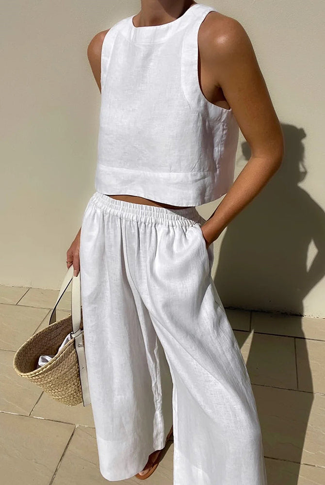 White linen crop top and wide leg pants set. Vacation style, perfect for summer days.