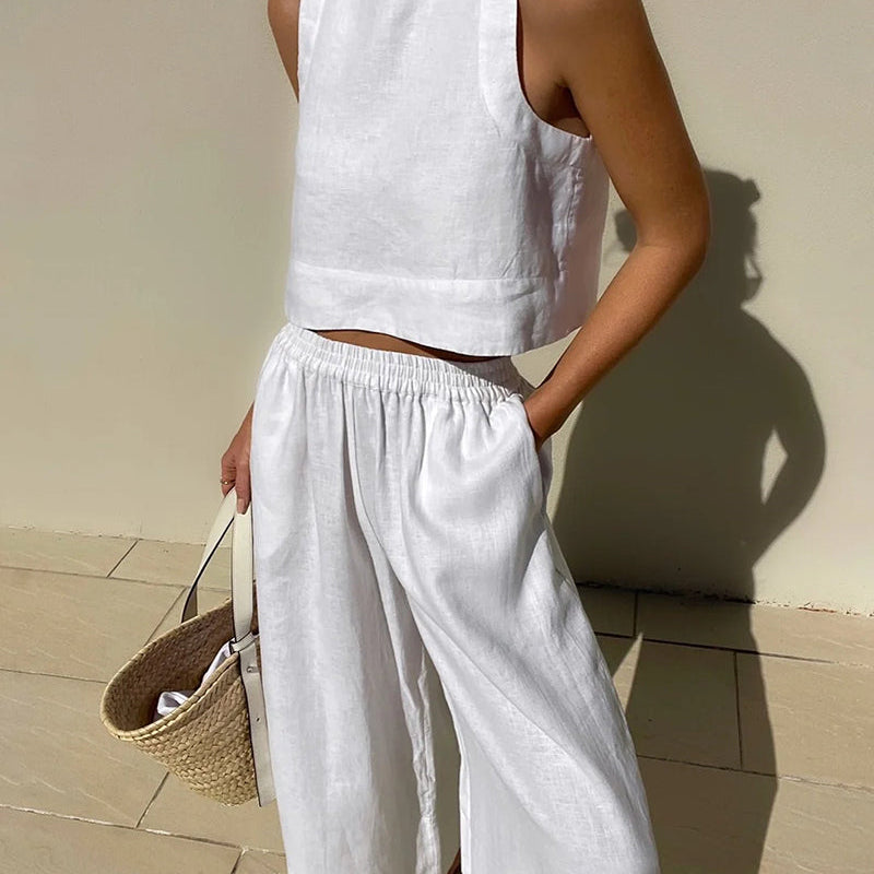 White linen crop top and wide leg pants set. Vacation style, perfect for summer days.