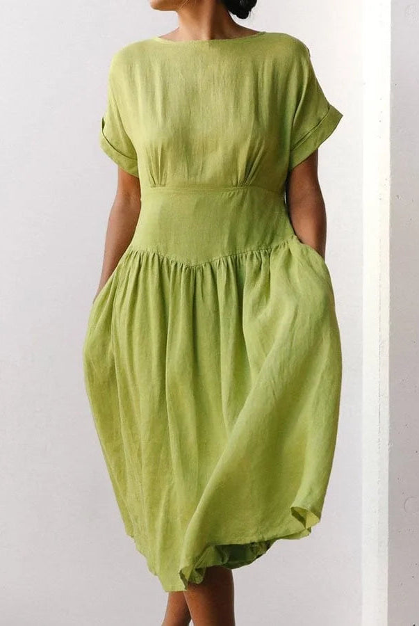 Linen Grass Green Midi Dress. Short-sleeved vacation dress with pockets. 55% cotton, 45% linen.